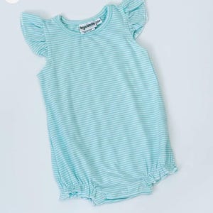 May include: A light blue and white striped baby romper with ruffled sleeves and leg openings. The romper has a round neckline and a label that reads "Jacques Marchais 12m". The fabric is soft and lightweight, perfect for warm weather.