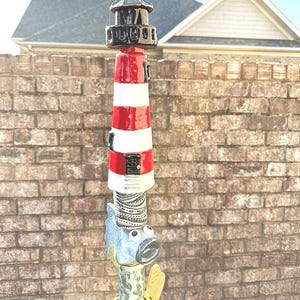 The lighthouse made by Connie Fish from the USA she used my design template to top off this magnificent tote pole. what would you do with your lighthouse? fabulous! thanks for sharing your pictures with us Connie.