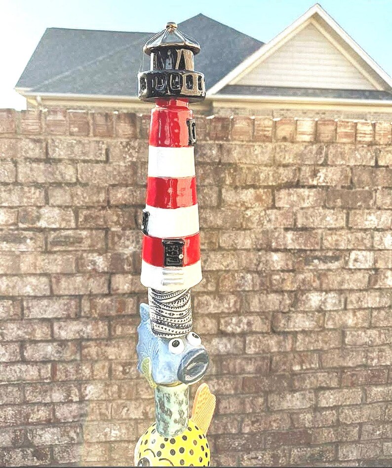 The lighthouse made by Connie Fish from the USA she used my design template to top off this magnificent tote pole. what would you do with your lighthouse? fabulous! thanks for sharing your pictures with us Connie.