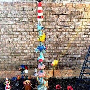 The lighthouse made by Connie Fish from the USA she used my design template the  lighthouse make this, to top off the magnificent tote pole. what would you do with your lighthouse? fabulous! thanks for sharing your pictures with us Connie.