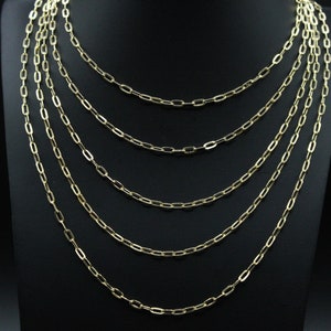 May include: A set of seven gold chain necklaces with a variety of lengths and link sizes.