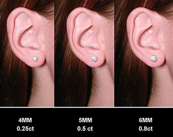 May include: A comparison chart showing the size of diamond earrings in millimeters and carats. The chart shows five different sizes of earrings, ranging from 3mm to 8mm. The earrings are shown on a model's ear.