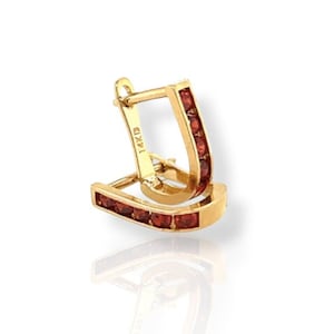 May include: A pair of gold hoop earrings, each featuring a line of small, red gemstones. The earrings are marked "14KID" and have a polished finish. The design is a classic style, suitable for various occasions. The gemstones are likely garnets.