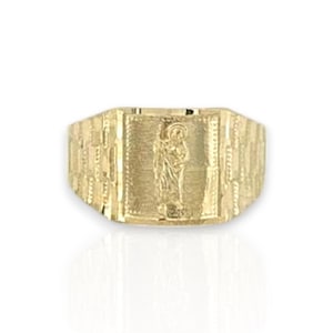 May include: A gold-colored ring with a rectangular face featuring a detailed embossed image of a religious figure. The ring has a textured band and a polished finish, suitable for religious jewelry.