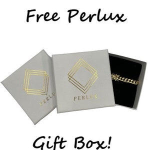 May include: Two white gift boxes with gold foil accents. The boxes have the text "Free Perlux" and "Perlux" printed on them. The boxes are open and show a black velvet box with a gold chain inside. The text "Gift Box!" is printed below the boxes.