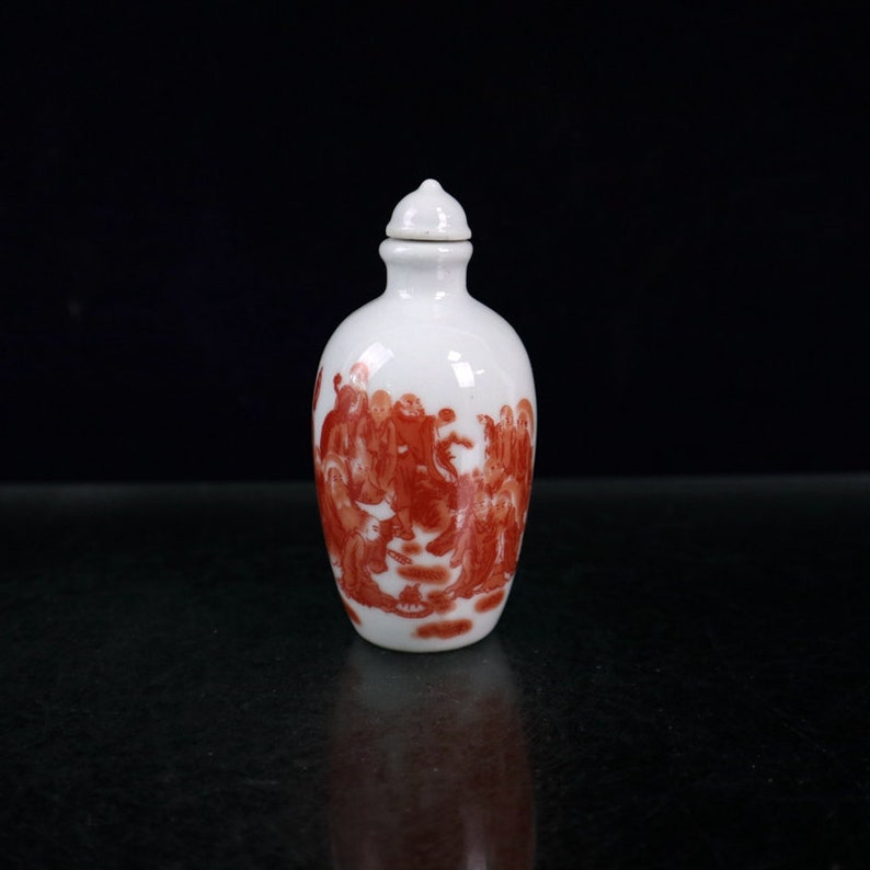 Jingdezhen Ceramic snuff bottle is an antique of China It is hand-painted with arhat pattern