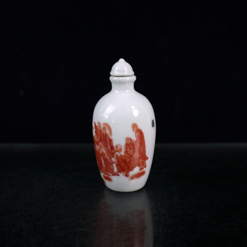 Jingdezhen Ceramic snuff bottle is an antique of China It is hand-painted with arhat pattern