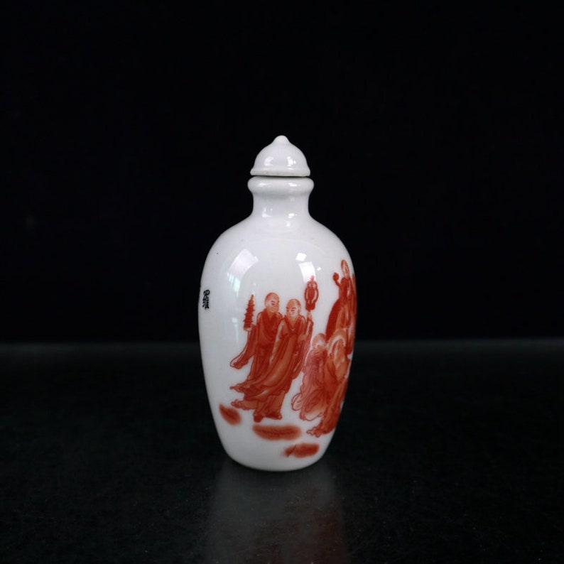Jingdezhen Ceramic snuff bottle is an antique of China It is hand-painted with arhat pattern