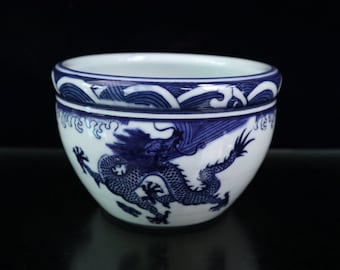 Jingdezhen Ceramic blue and white dragon VAT is an antique of China. It's hand drawn and painted with exquisite and rare patterns