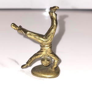 Rare Antique Victorian Brass Pipe Tamper – Cartwheeling Boy Figure (c. 1850–1880)