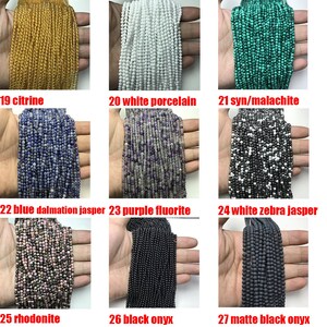 May include: Assortment of 10 strands of beads in various colors and materials, including citrine, white porcelain, synthetic malachite, blue dalmatian jasper, purple fluorite, white zebra jasper, rhodonite, black onyx, and matte black onyx.