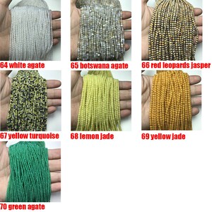 May include: Assortment of 10 strands of gemstone beads, including white agate, botswana agate, red leopards jasper, yellow turquoise, lemon jade, yellow jade, and green agate.