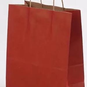 May include: A red paper shopping bag with brown paper handles. The bag is rectangular with a glossy finish. The handles are twisted and attached to the top of the bag. The bag is empty.