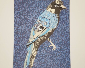 Paper bird collage with blue background