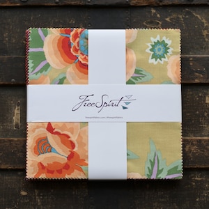 May include: A package of four fabric squares with a floral pattern in shades of orange, green, and purple. The fabric squares are packaged together with a white label that says "Free Spirit" and includes the website address "freespiritfabrics.com" and the hashtag "#freespiritfabrics".