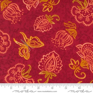 May include: Red fabric with a repeating pattern of orange and yellow flowers and butterflies. The fabric has a subtle texture and a slightly faded look.