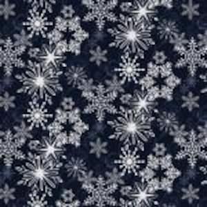 May include: A repeating pattern of white and silver snowflakes on a dark blue background. The snowflakes vary in size and design, creating a wintery, festive look. This fabric is suitable for holiday-themed crafts and apparel.