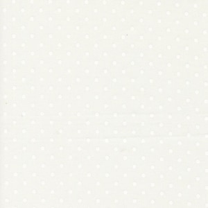 May include: Cream-colored fabric with a repeating pattern of small, evenly spaced white polka dots. The dots are slightly raised, creating a subtle texture. The fabric appears to be a light material, suitable for various sewing projects.