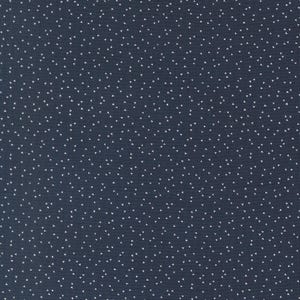 May include: Dark navy blue fabric with a repeating pattern of small white triangles. The triangles are evenly spaced across the surface, creating a speckled effect. The fabric has a subtle texture.