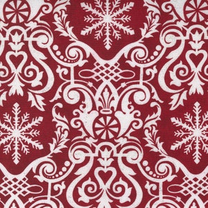 May include: Red fabric with a white damask pattern featuring snowflakes and swirls. The fabric has a textured surface.