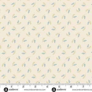 May include: Cream-colored fabric with a repeating pattern of small blue and gold-colored leaves. The fabric has a ruler along the bottom edge with the Andover Fabrics logo and website address.