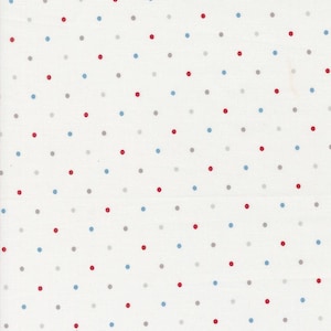 May include: White fabric with a repeating pattern of small, evenly spaced dots. The dots are in red, blue, and gray, creating a simple yet visually appealing design. The fabric appears to be cotton or a similar material.