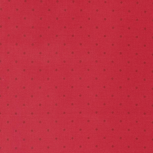 May include: A close-up of a red fabric with a repeating pattern of small, evenly spaced, dark brown dots. The fabric has a slightly textured appearance, and the dots are uniformly sized and colored.