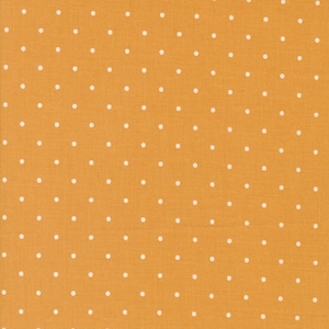 May include: Mustard yellow fabric with a repeating pattern of small, evenly spaced white polka dots. The fabric has a textured appearance, suggesting a woven material. This textile is suitable for various sewing and crafting projects.