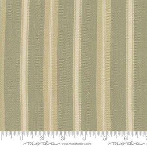 May include: A close-up of a fabric with alternating stripes of light green and cream. The fabric is textured and has a subtle sheen. The fabric is measured in inches with the text "moda" printed on the ruler.