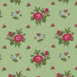 May include: A green fabric with a repeating pattern of pink roses, small white flowers, and red berries.