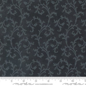May include: A dark blue fabric with a repeating pattern of light blue stylized floral vines. The fabric has a subtle textured look.