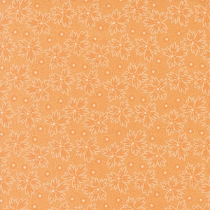 May include: Orange fabric with a white floral pattern. The pattern features small white dots and larger white flowers with a delicate, lacy design.