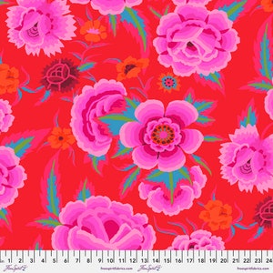 May include: A red fabric with a pink floral pattern. The flowers are stylized and have a layered look. The fabric has a repeating pattern.
