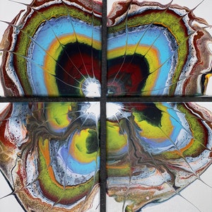May include: Four square canvases with a colorful abstract painting of swirling colors in shades of red, yellow, green, blue, and white. The painting has a radial design with a white center and a black ring around it.