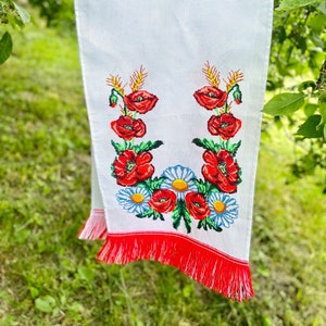 Hand-embroidered table runner with vibrant floral design