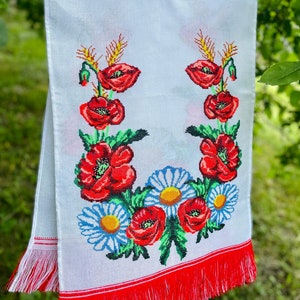 Hand-embroidered table runner with vibrant floral design