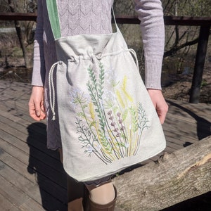 Handwoven blue drawstring bag with geometric embroidery, Boho crossbody bag, Ethnic-inspired backpack with adjustable straps image 7