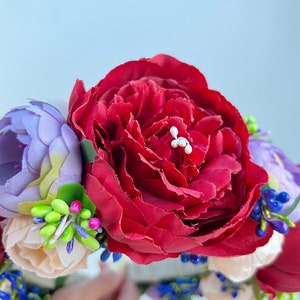 Large beautiful handmade wreath on the head. Made from artificial flowers. Will complement any holiday look. Made in Ukraine.