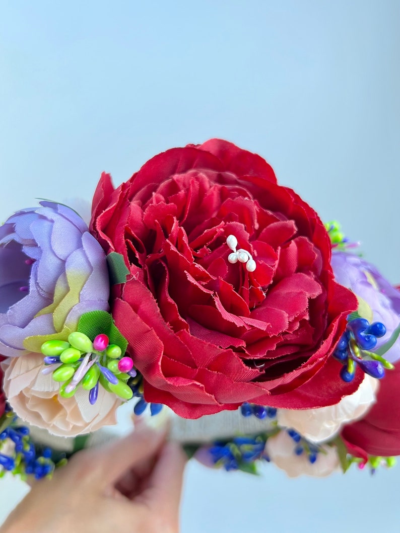 Large beautiful handmade wreath on the head. Made from artificial flowers. Will complement any holiday look. Made in Ukraine.