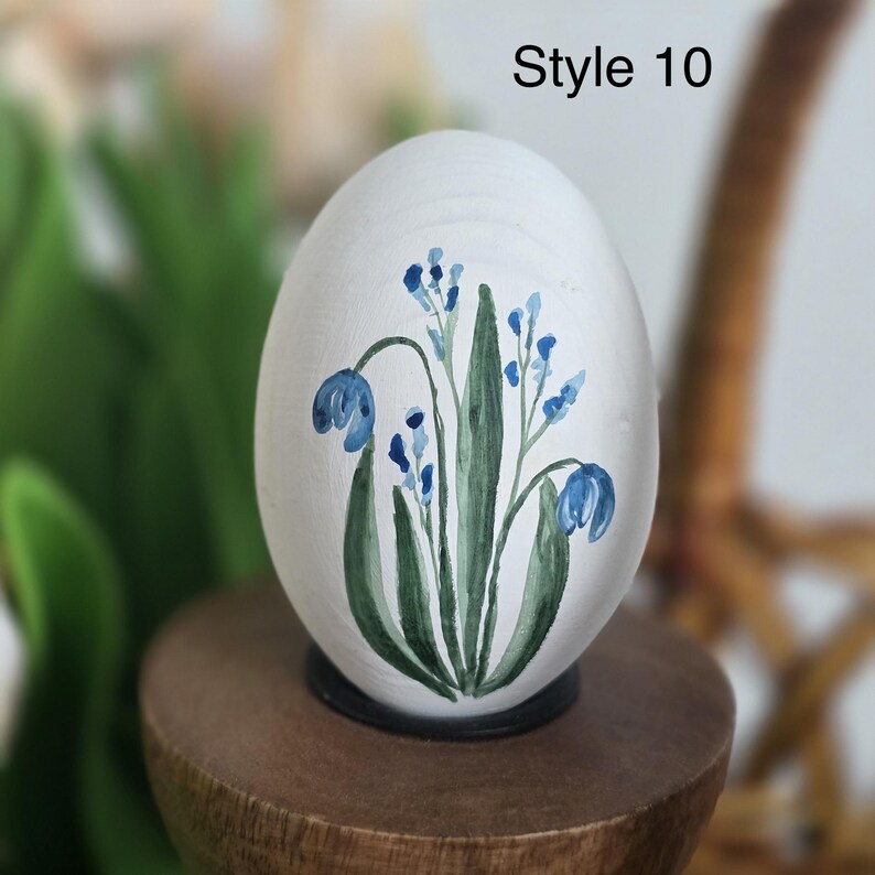 May include: A set of three ceramic mugs with a speckled, matte finish. The mugs are in shades of cream, light gray, and dark gray. Each mug has a simple, minimalist design and a rounded handle. The mugs are suitable for coffee, tea, or other beverages.