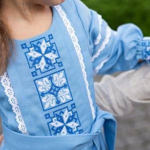 Traditional blue embroidered Ukrainian girl dress with long sleeves and white lace trim, Folk style cotton outfit for special occasions