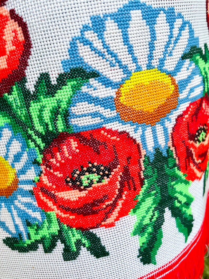 Hand-embroidered table runner with vibrant floral design