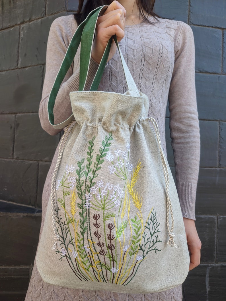 Handwoven blue drawstring bag with geometric embroidery, Boho crossbody bag, Ethnic-inspired backpack with adjustable straps image 8