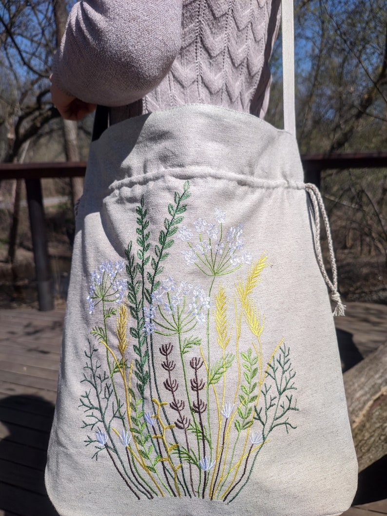 Handwoven blue drawstring bag with geometric embroidery, Boho crossbody bag, Ethnic-inspired backpack with adjustable straps image 9