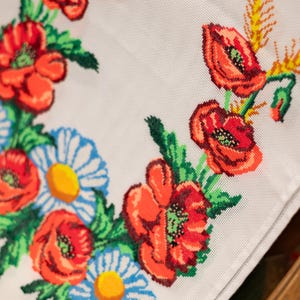 Hand-embroidered table runner with vibrant floral design