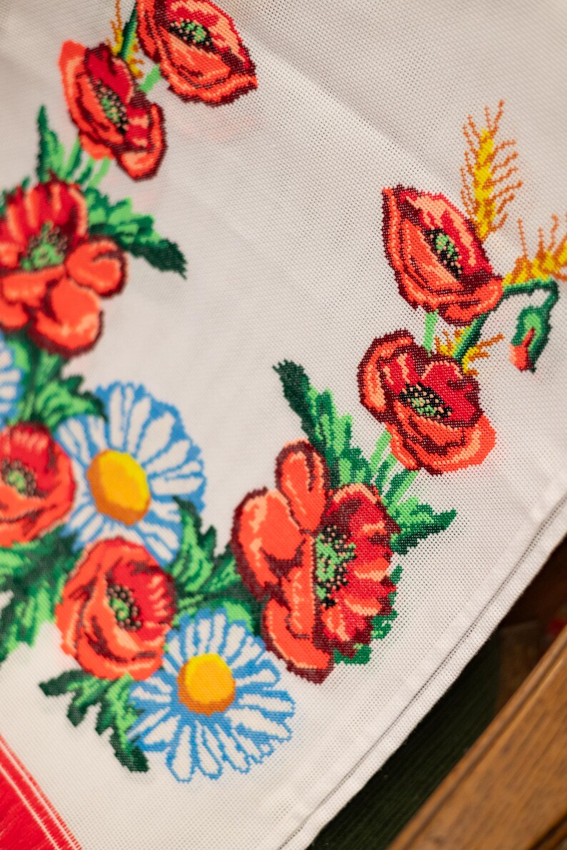 Hand-embroidered table runner with vibrant floral design