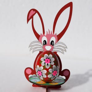 Hand painted wooden Easter egg with bright folk art floral pattern