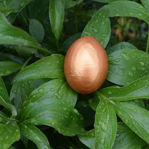 Handmade golden decorative Easter egg for elegant spring table decor or unique seasonal holiday accent