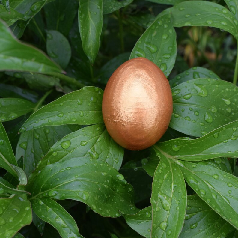 Handmade golden decorative Easter egg for elegant spring table decor or unique seasonal holiday accent