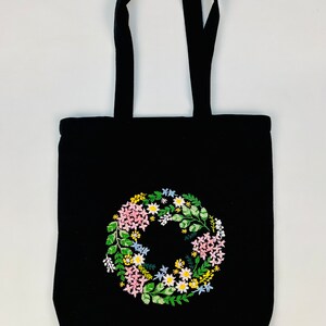 Handmade black tote bag with floral embroidery
